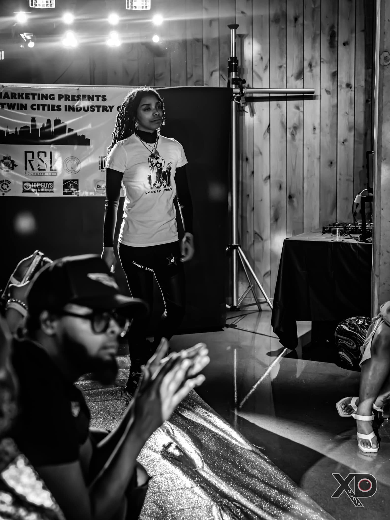 Black and white photo of model at Twin Cities Industry event