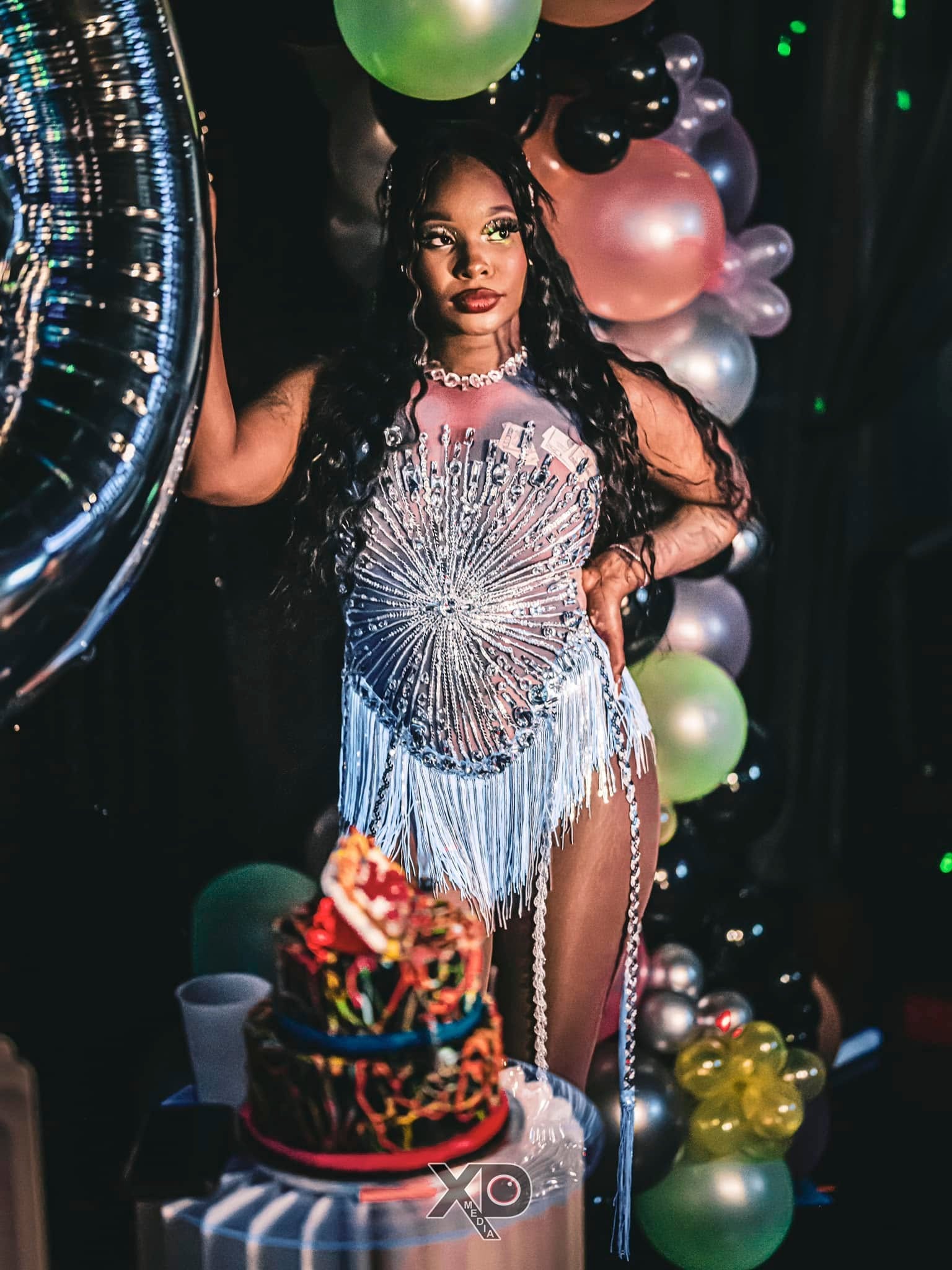 Woman in rhinestone outfit at birthday celebration
