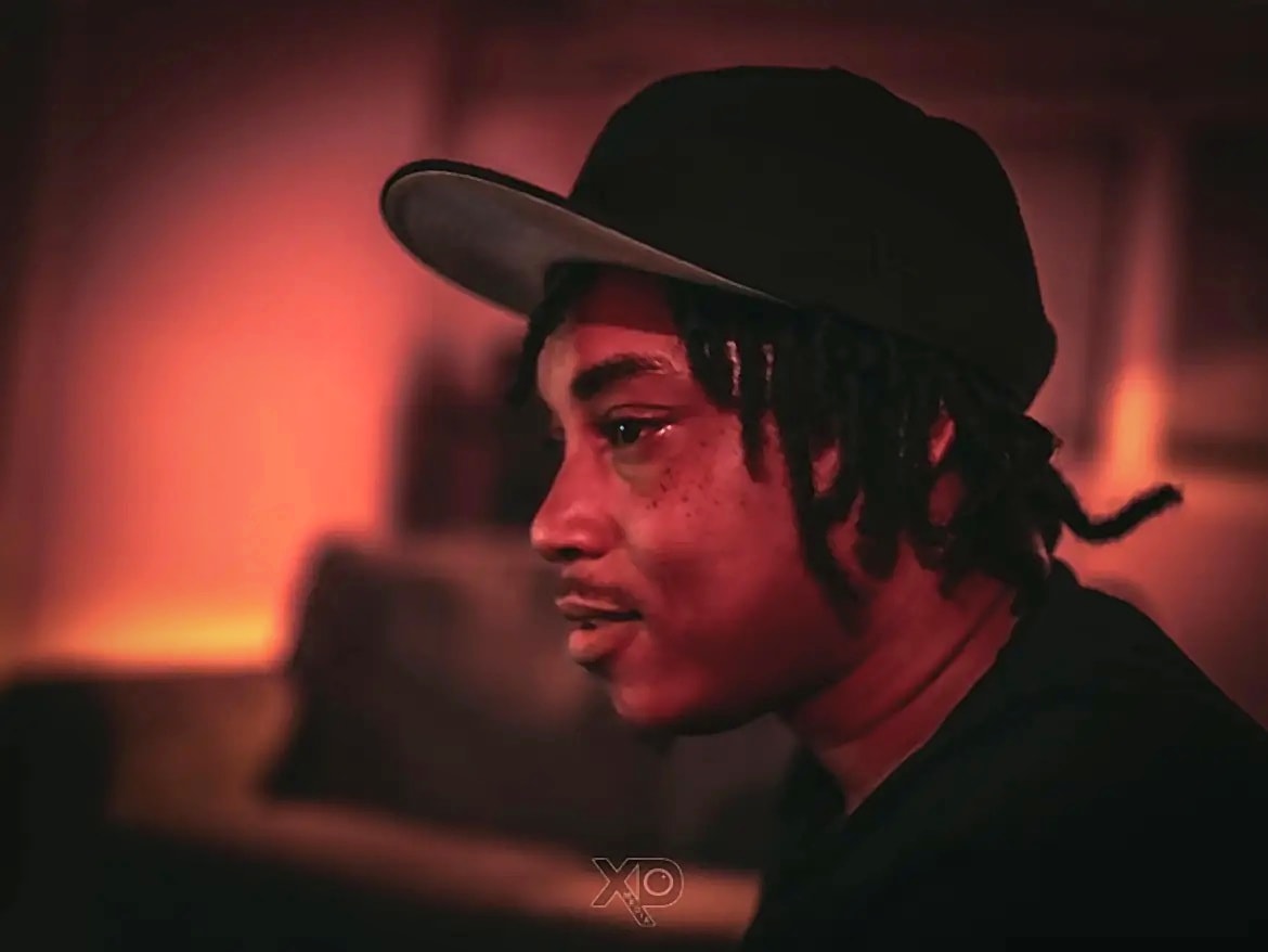 Z Boy warm-toned portrait with logo watermark