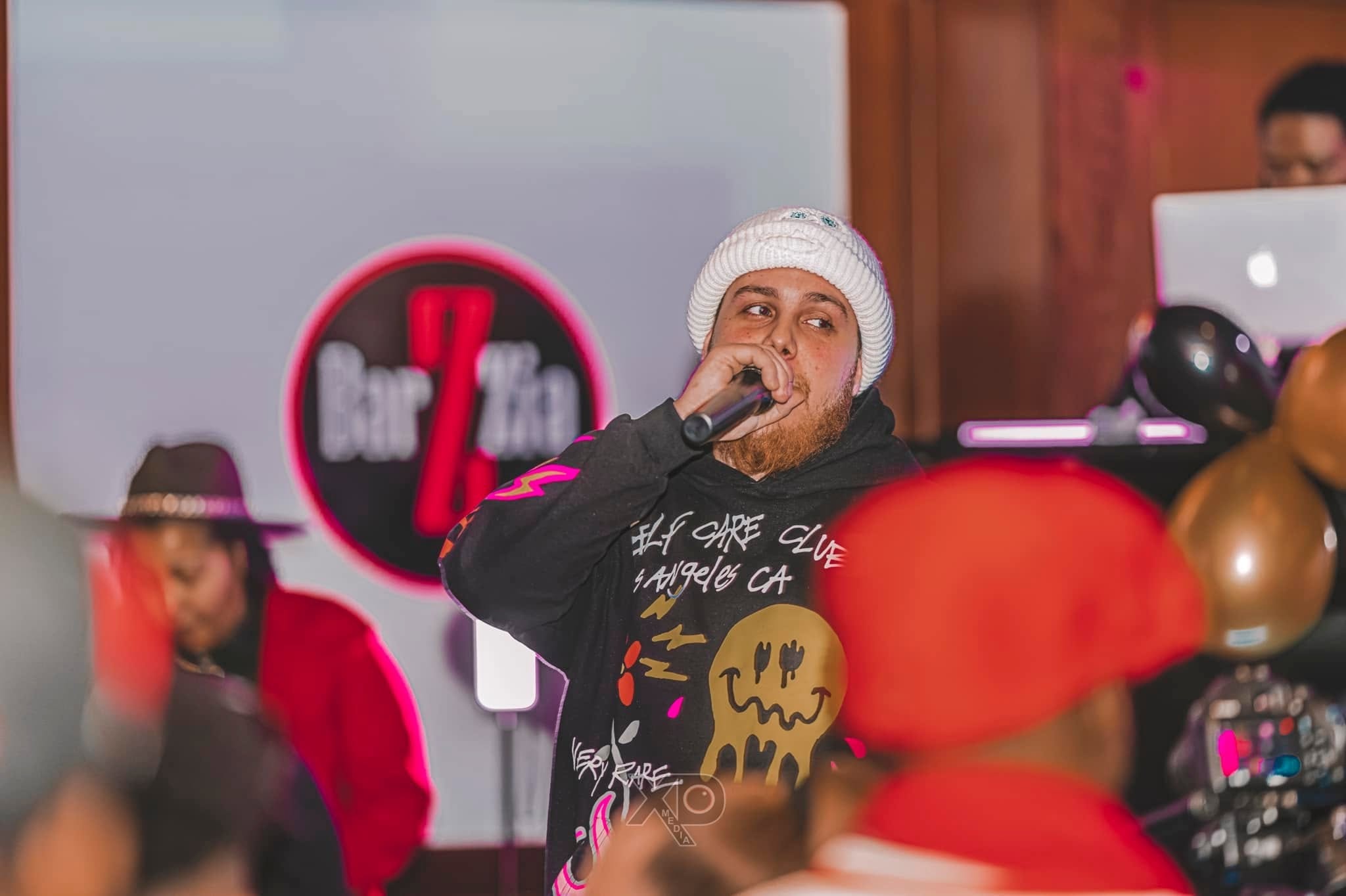 Performer on stage with microphone at live event