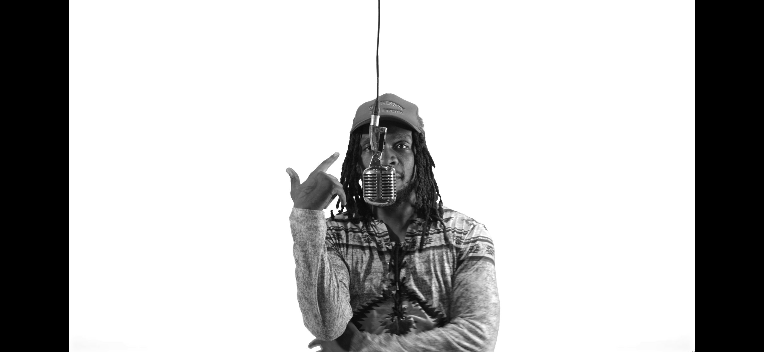 Performer with vintage microphone black and white green screen session
